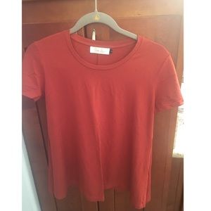 Cute dark orange blouse by Ava Sky.